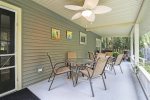 Expansive back porch overlooking the fenced-in yard